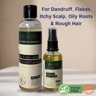 Two bottles of olive village restorative shampoo and oil on a beige background