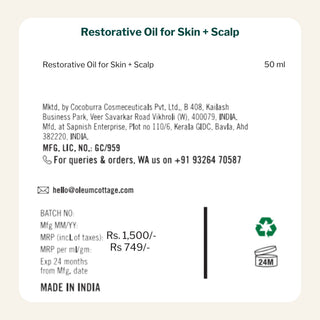 Label of Restorative Oil for Skin + Scalp with product details on a beige background